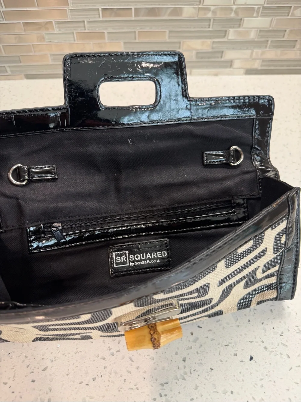 Sondra Roberts Black and Cream Geometric Canvas Clutch with Bamboo Accent